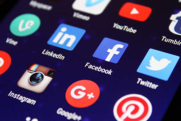 Smartphone showing social media icons - Social media management
